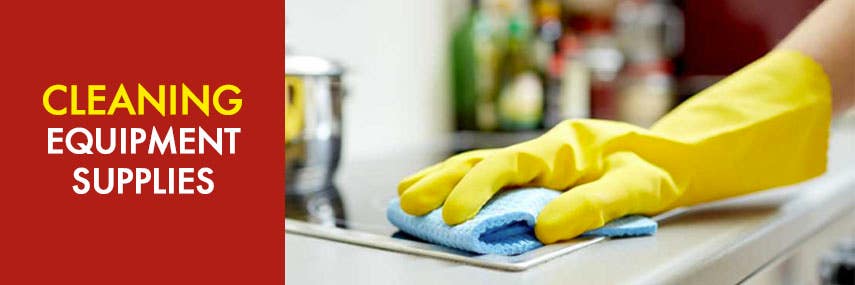 Cleaning Equipment Supplies - Yellow rubber glove cleaning a hob with a blue sponge